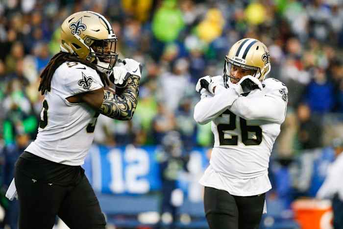 New Orleans Saints cornerback P.J. Williams (26) and linebacker Demario Davis (56) celebrate following against the Seattle Seahawks. Mandatory Credit: Joe Nicholson-USA TODAY Sports